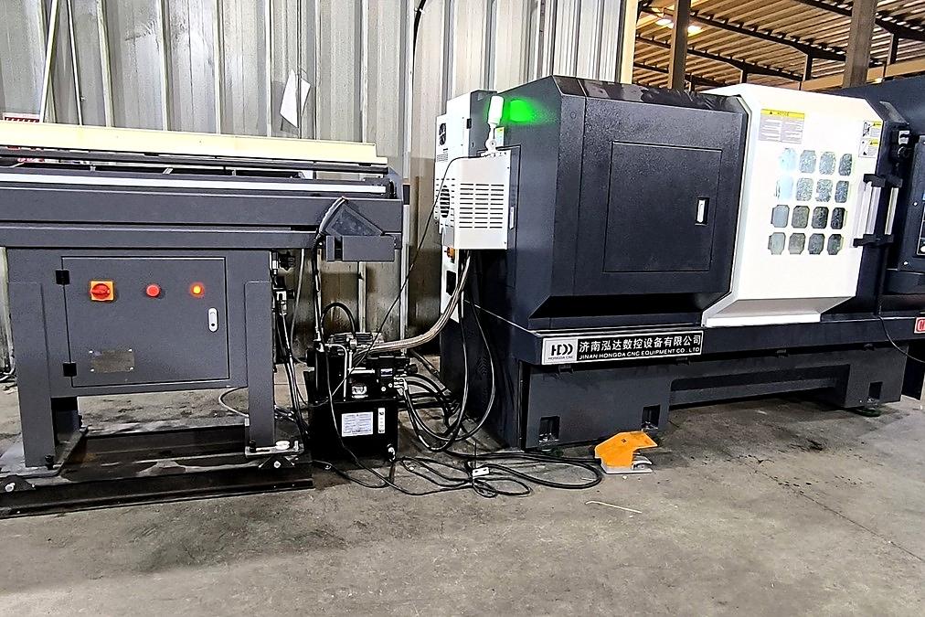 New CNC lathe with bar feeder – SBSCO